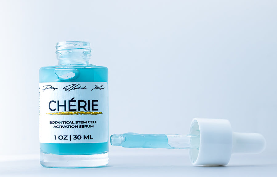 Chérie botanical stem cell activation serum bottle with dropper on a light blue background