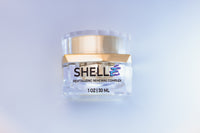 Skincare jar labeled 'SHELL' on a light gray background